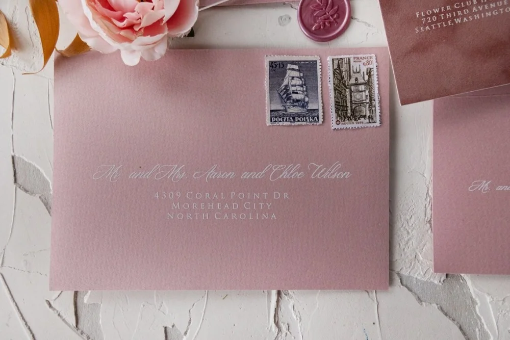 Blush pink themed wedding invitation with velvet texture.