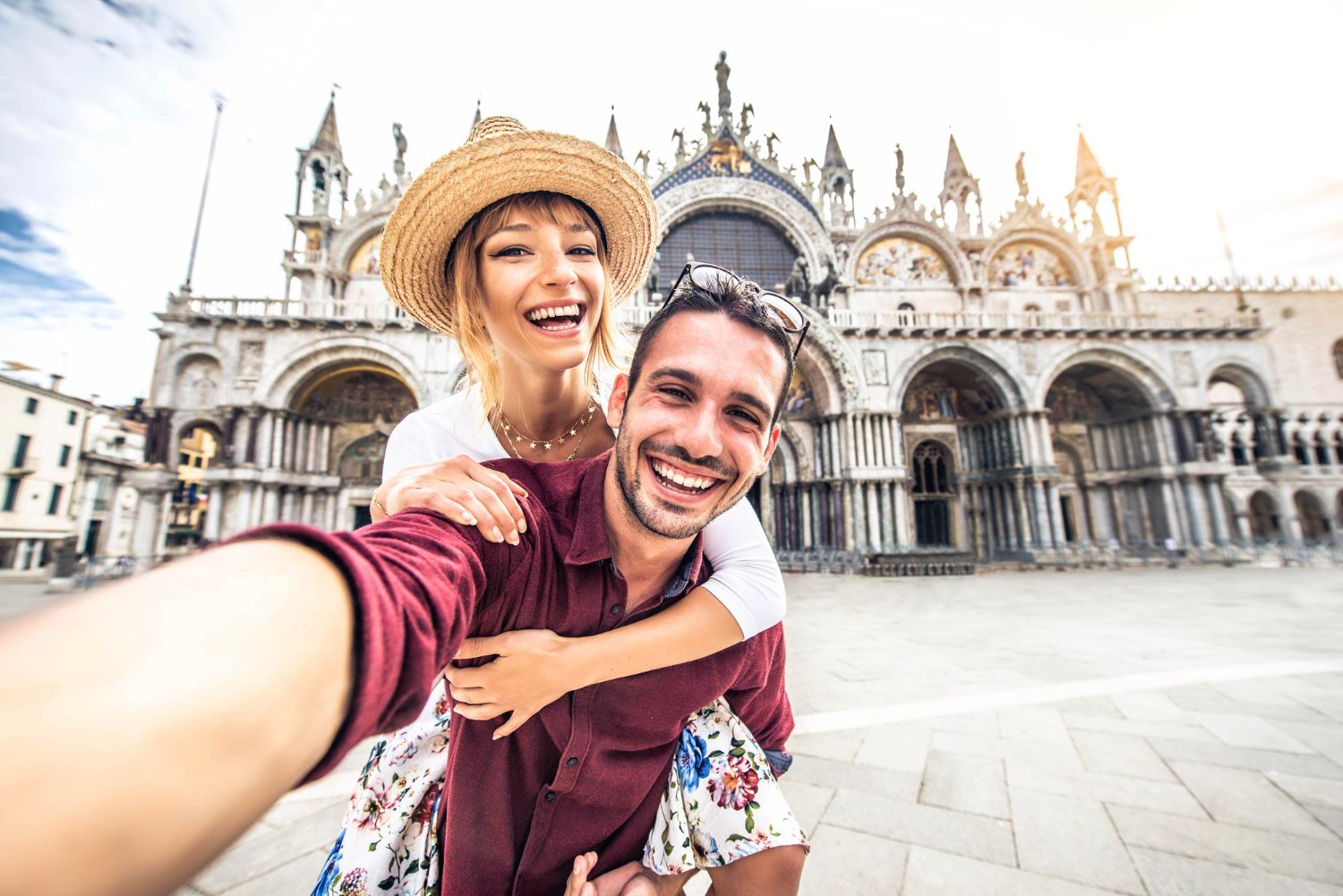 Beautiful young couple having fun visiting Venice