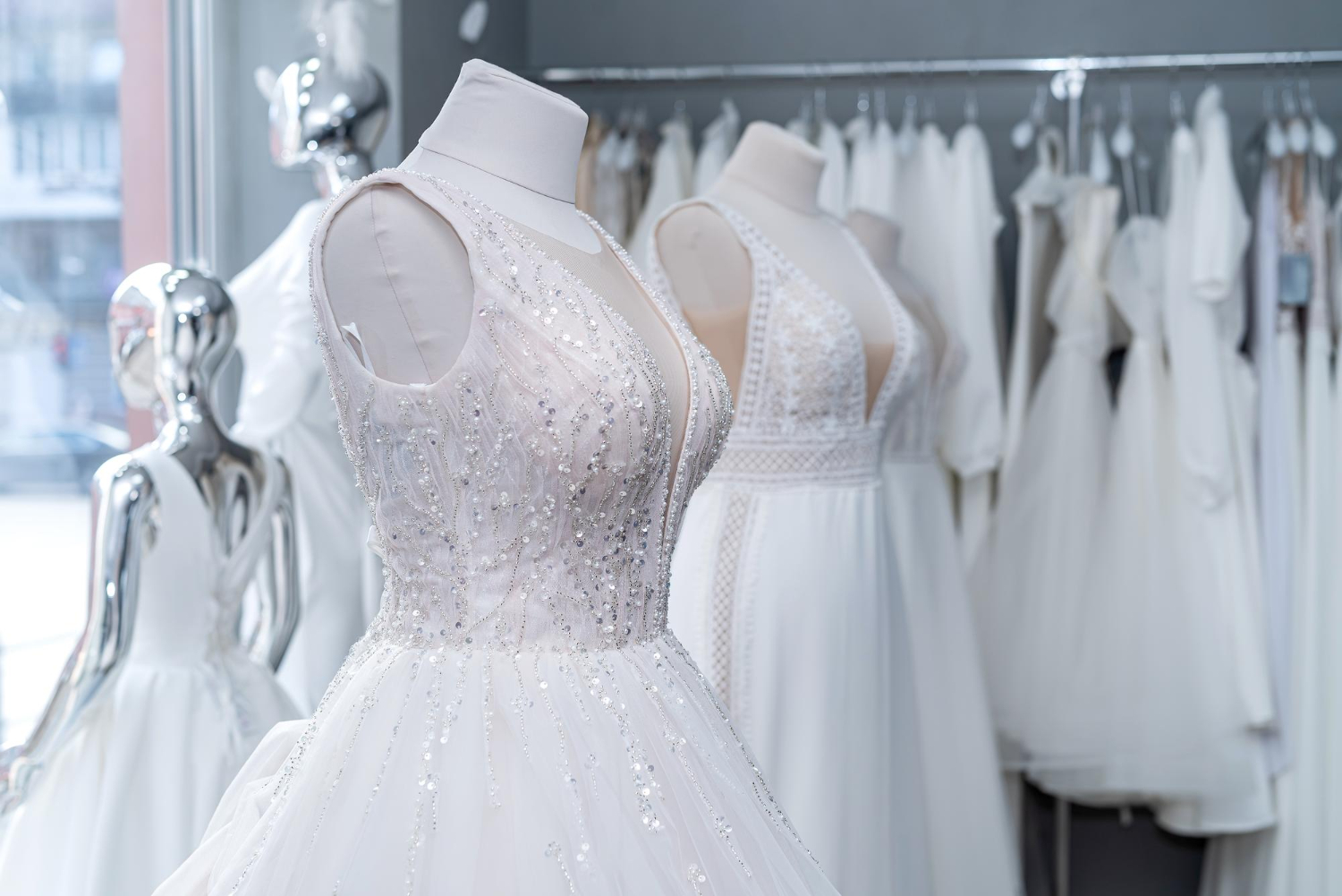  beautiful wedding bridal dresses on mannequin in showroom in mall