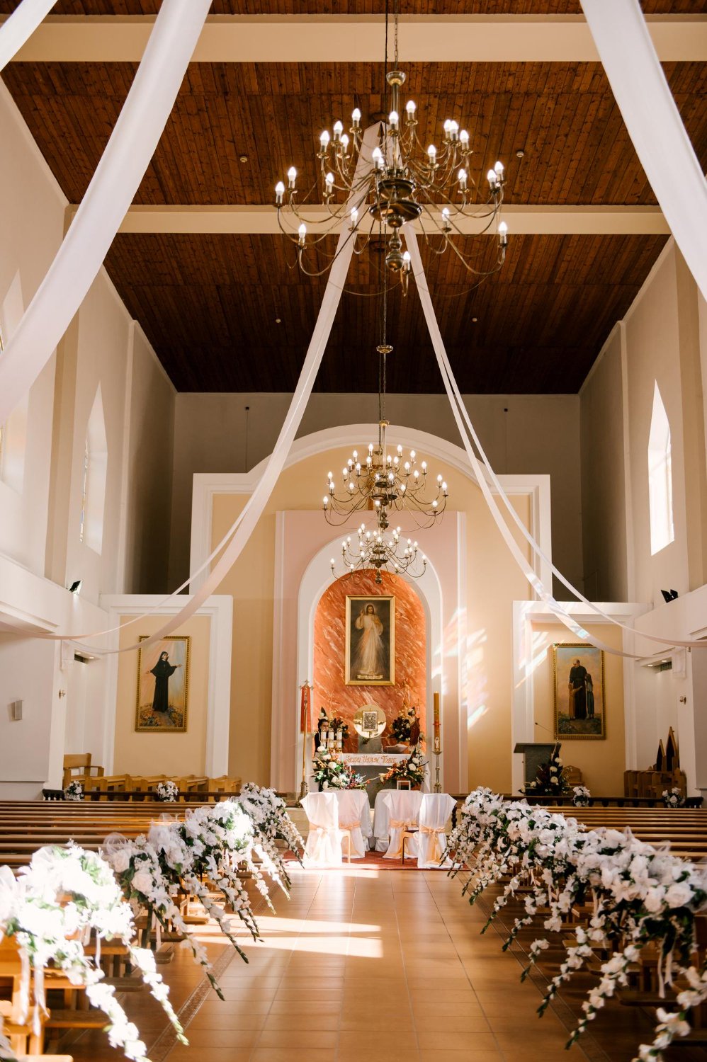 the church is decorated for the wedding
