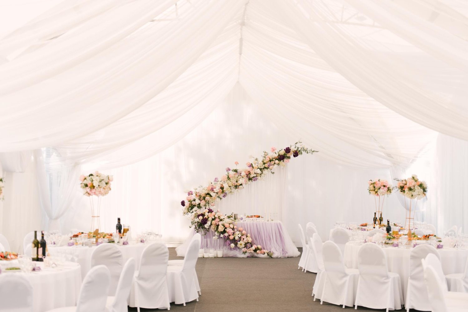uxury wedding dinner in a large beautiful tent beautiful decor for the wedding