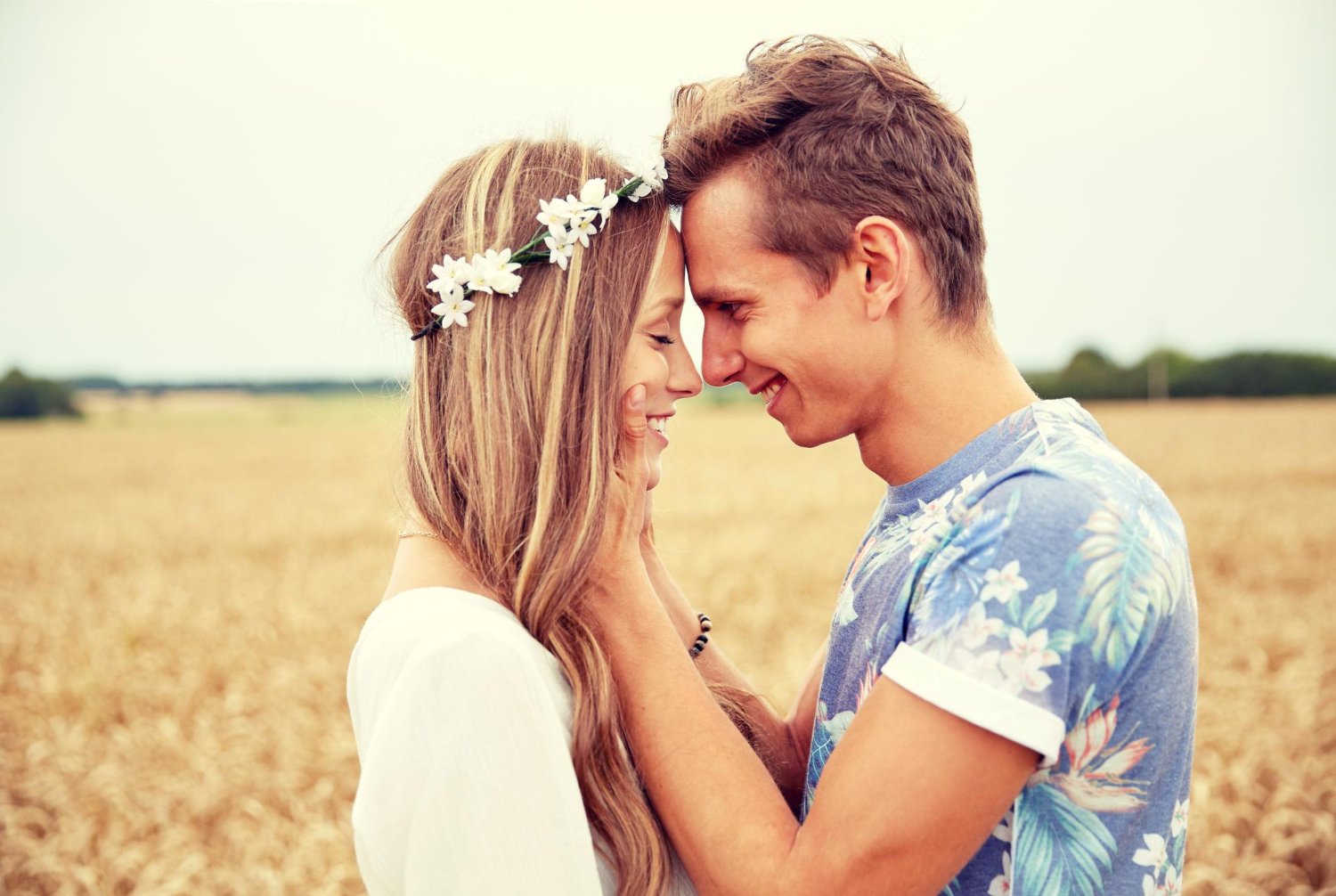 happy smiling young hippie couple hugging outdoors