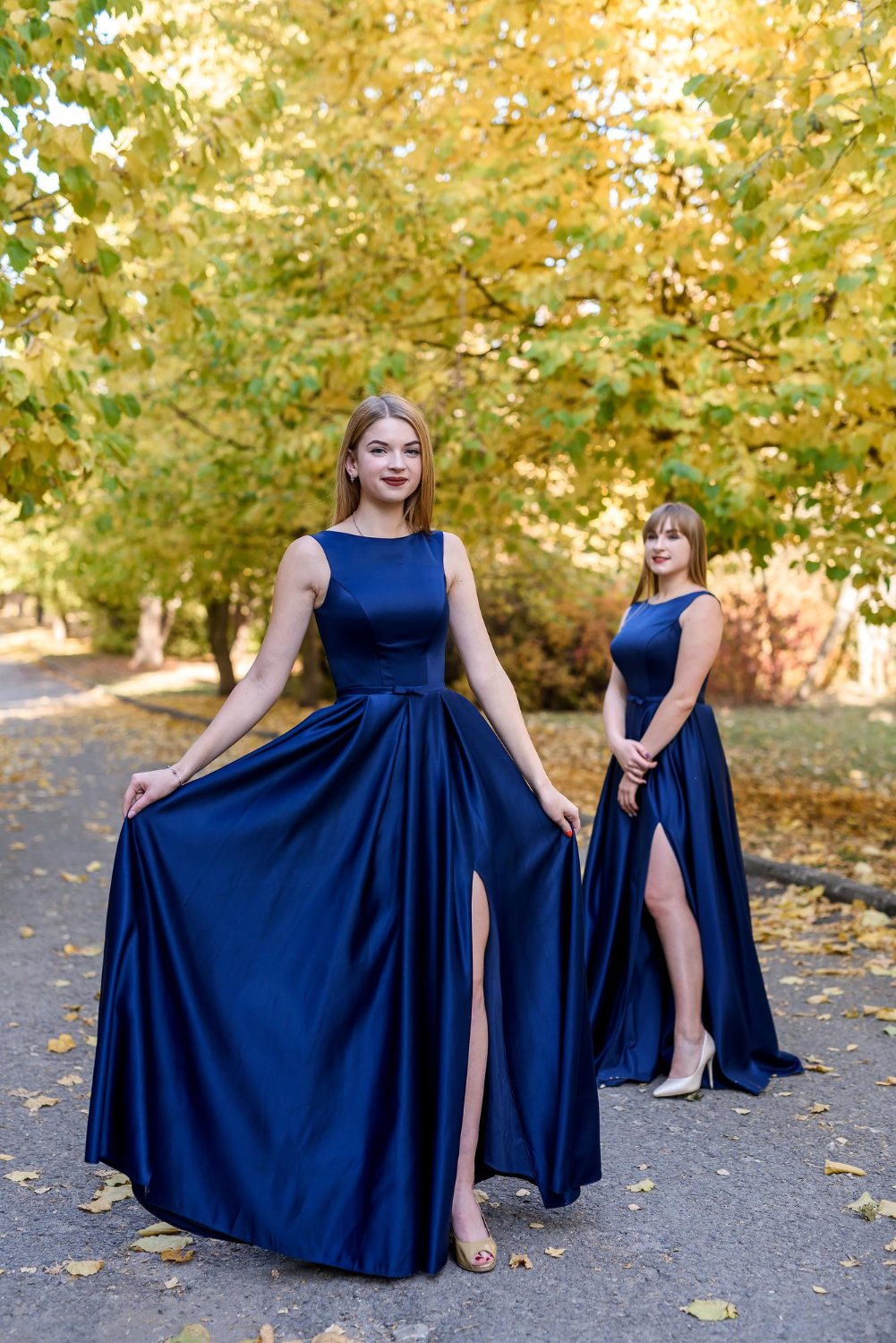 young ladies in fashionable blue dresses