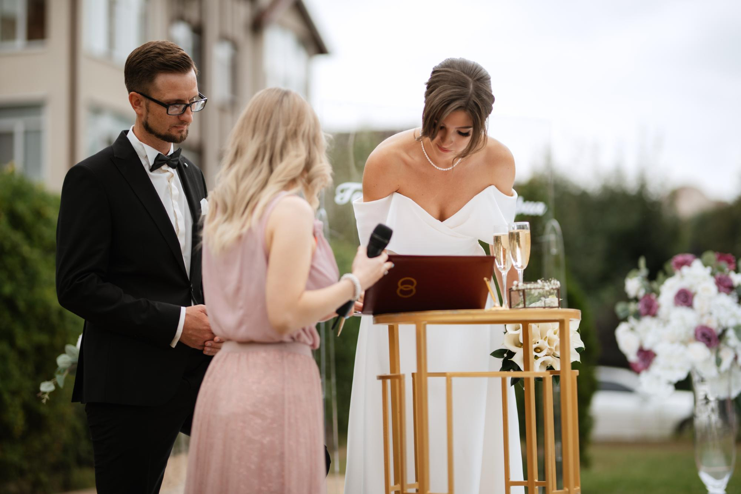 wedding ceremony of the newlyweds on the glade