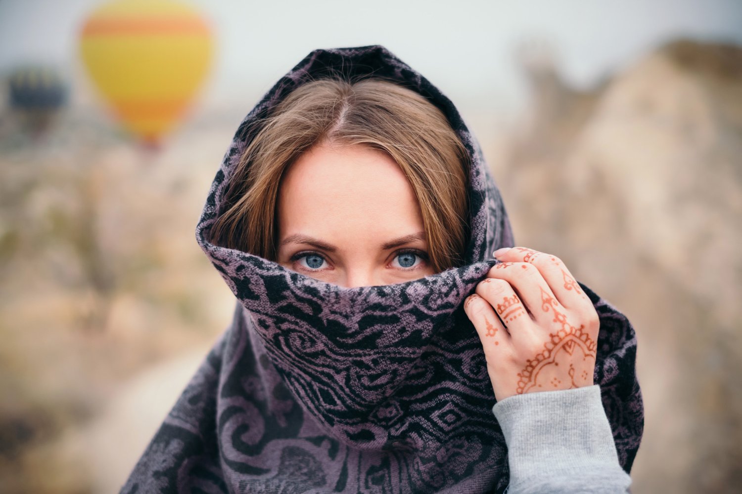 woman face covered with scarf