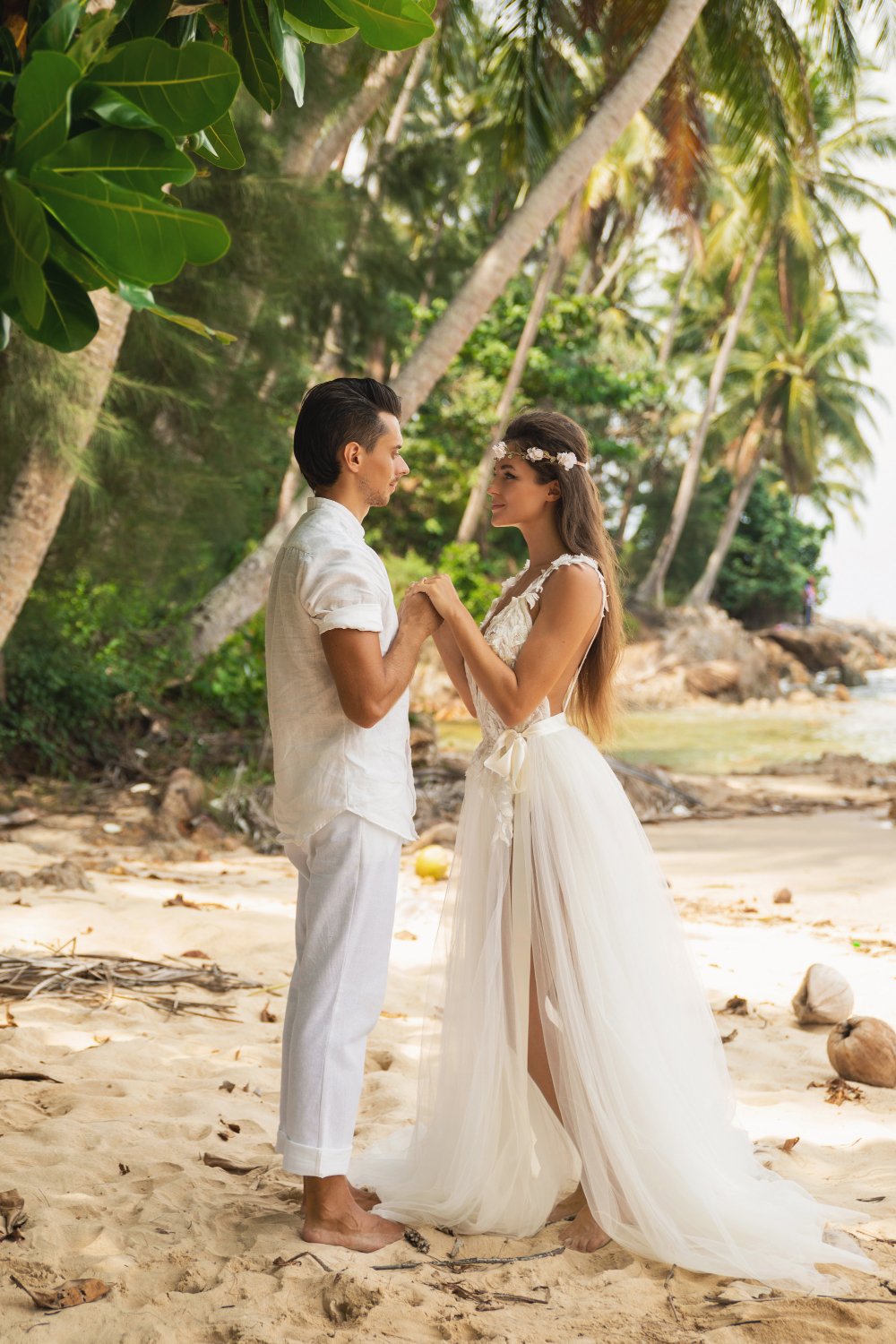  young and beautiful couple is celebrating wedding on the beach