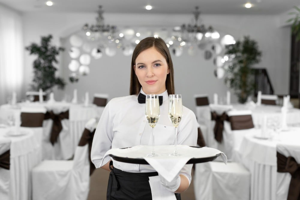 What does a hostess do at a Wedding ?